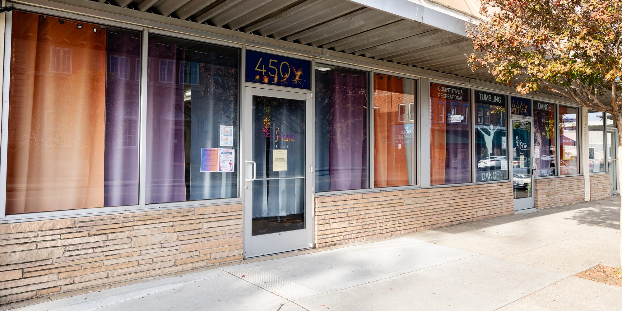 Both Ignite Your Flare storefronts side by side on Walnut St.