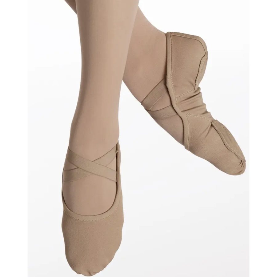 Tan canvas ballet shoes with crisscrossed elastic straps