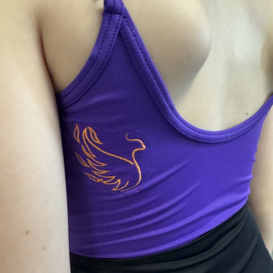 Purple uniform leotard with an orange embroidered Flare phoenix