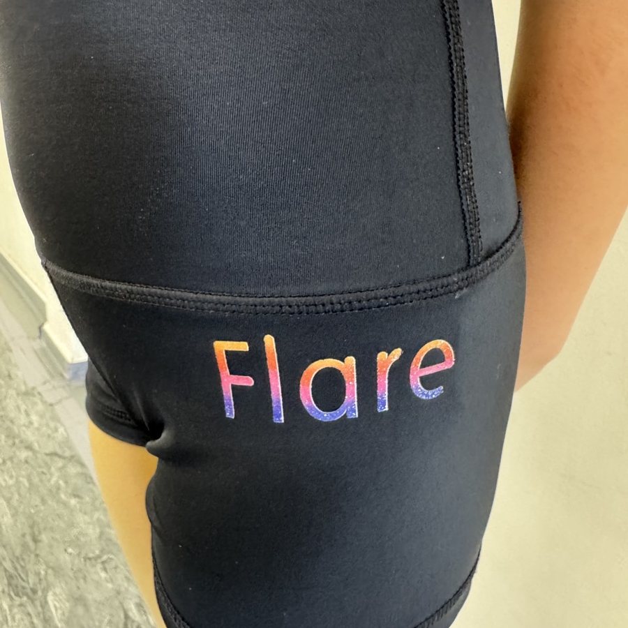 Black uniform shorts with a printed ombre Flare logo